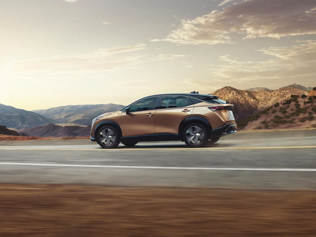 Nissan Ariya driving down road